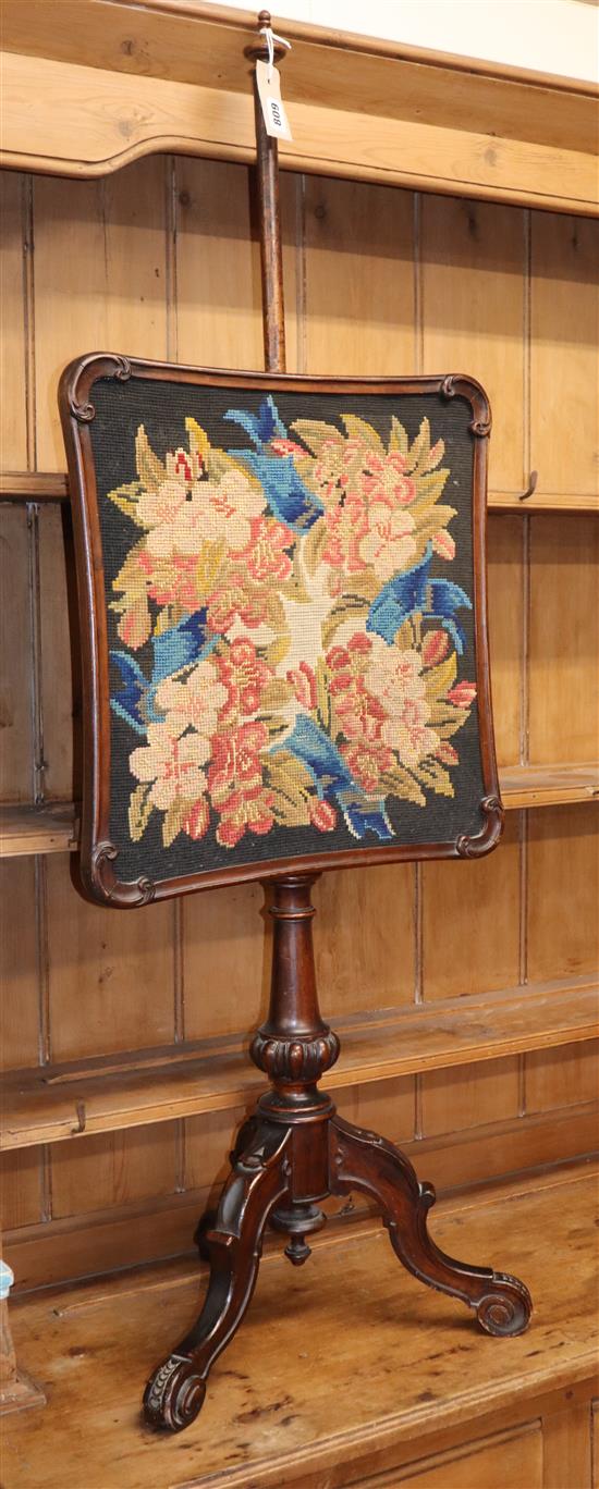 A Victorian mahogany adjustable tripod pole screen with tapestry banner
